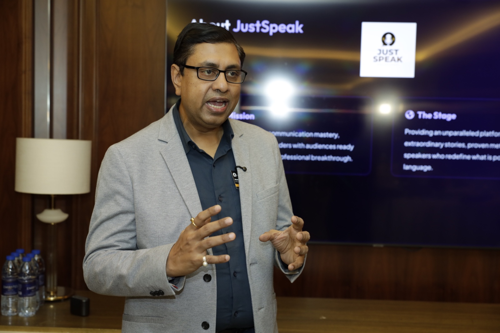 Host presenting the About JUST Speak session