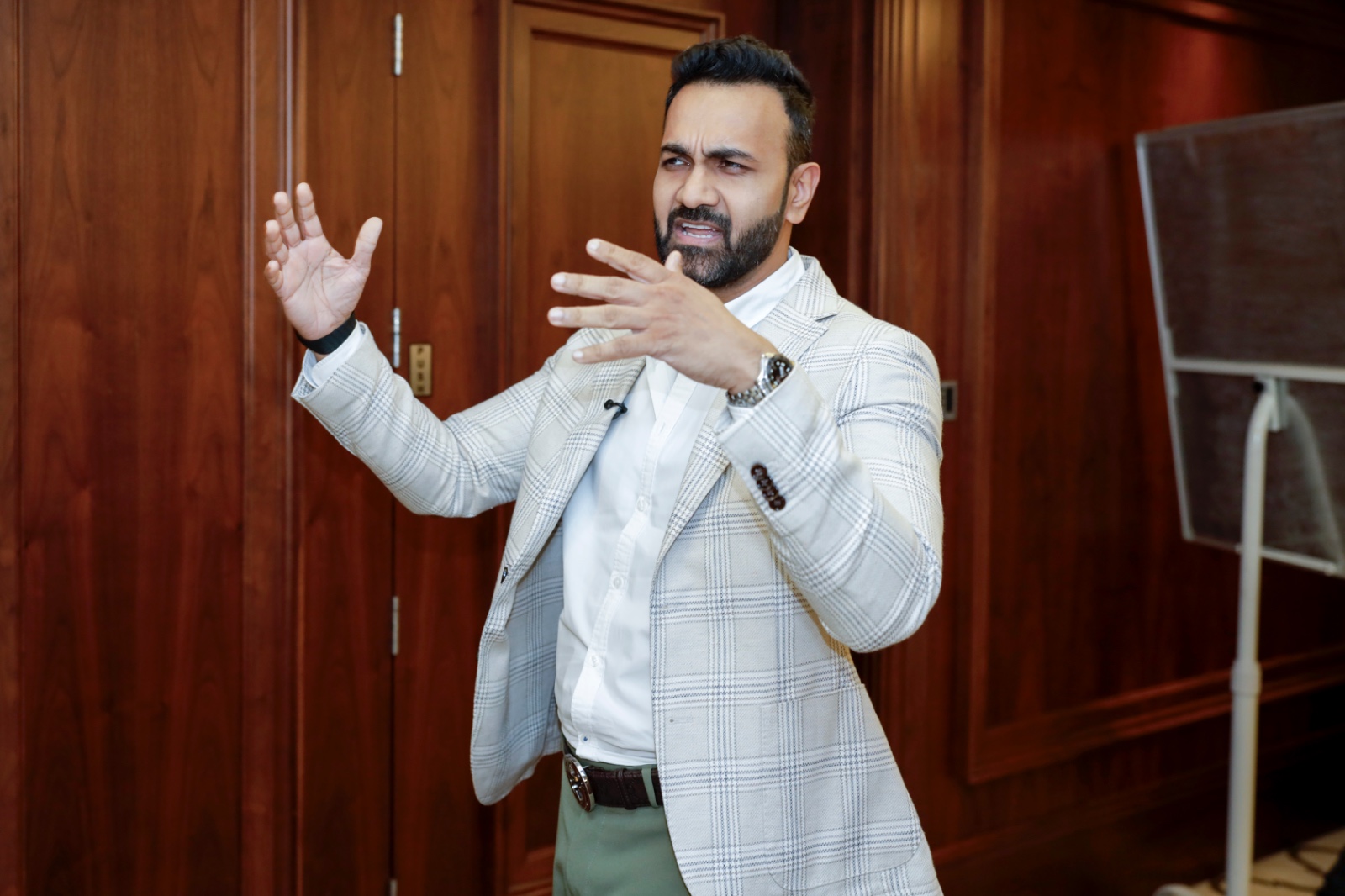 Participant using gestures while speaking on stage